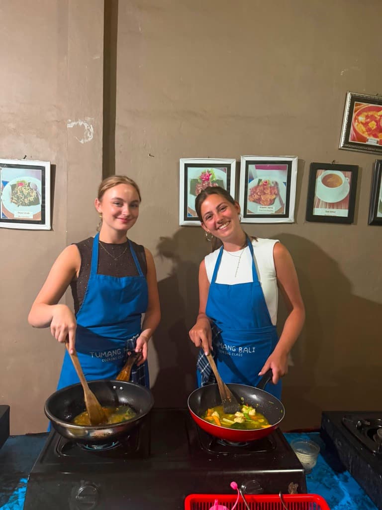 Guests chopping fresh ingredients in our Ubud kitchen